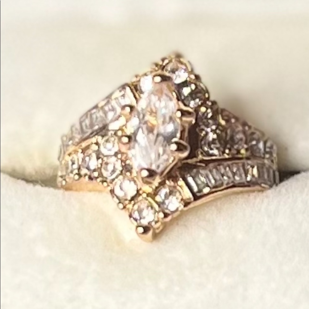 Sz. 8 One karat Faux Marquis center diamond look with several baguettes